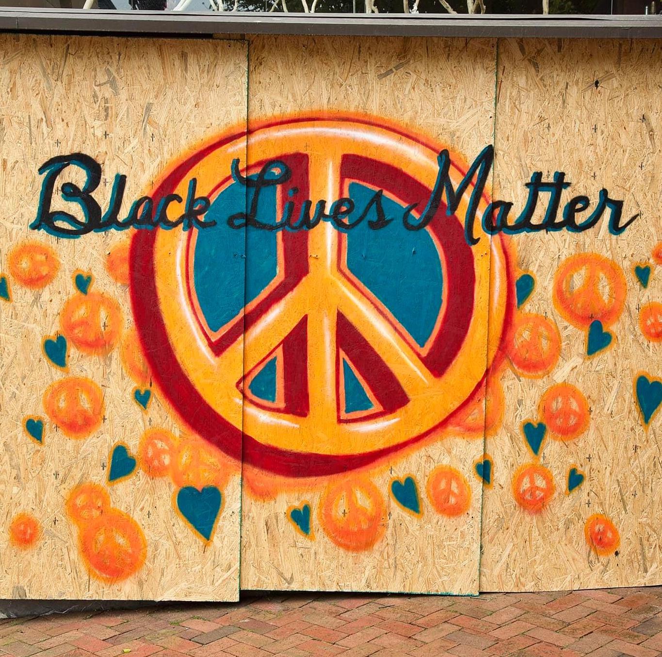 Black Lives Matter graffiti for defund police protest