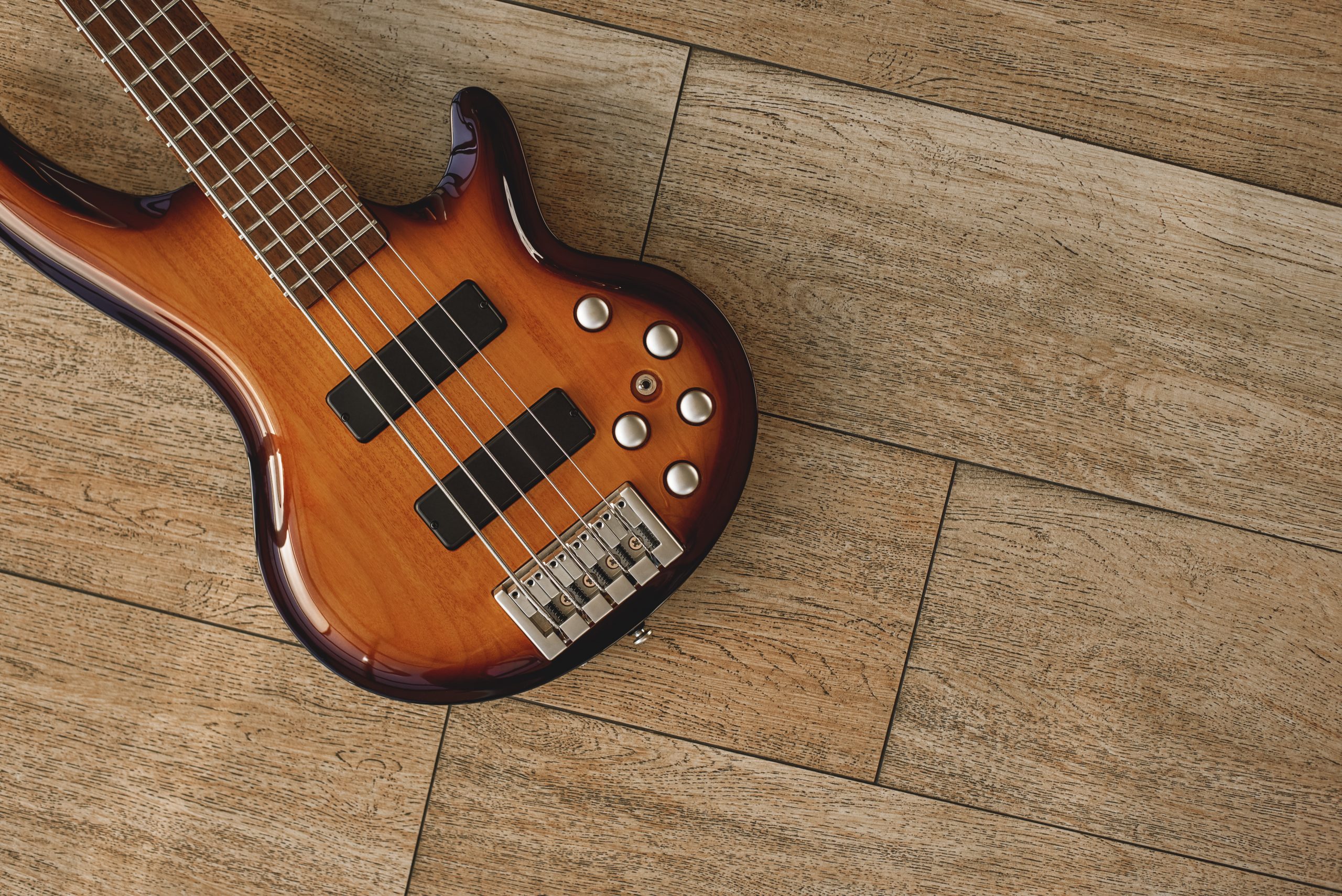 Closeup of guitar body on floor