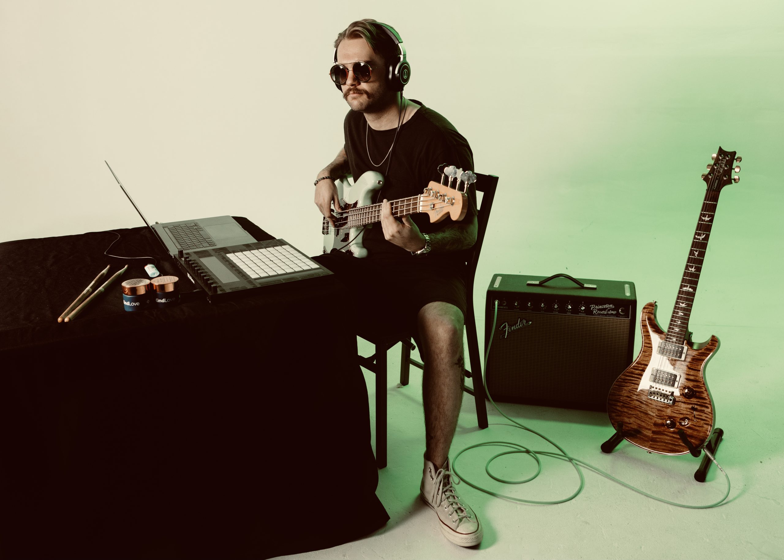 press photo at table of bassist jay greens interview