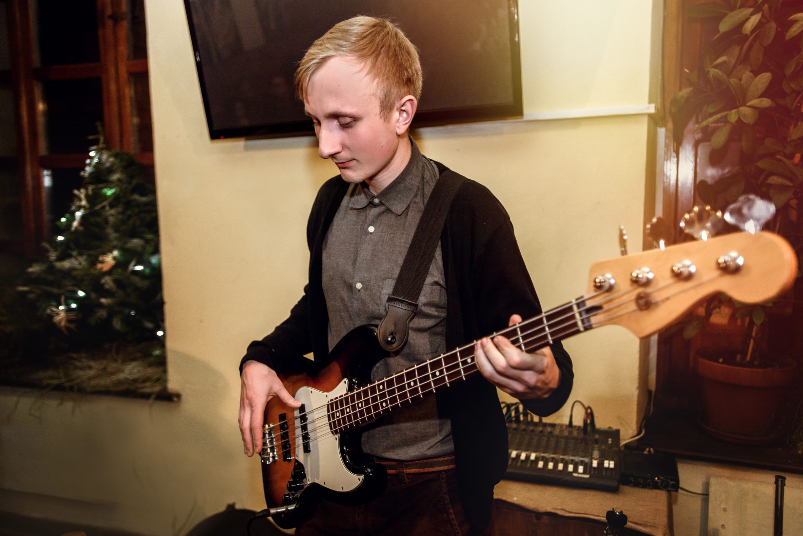 guy standing with bass guitar