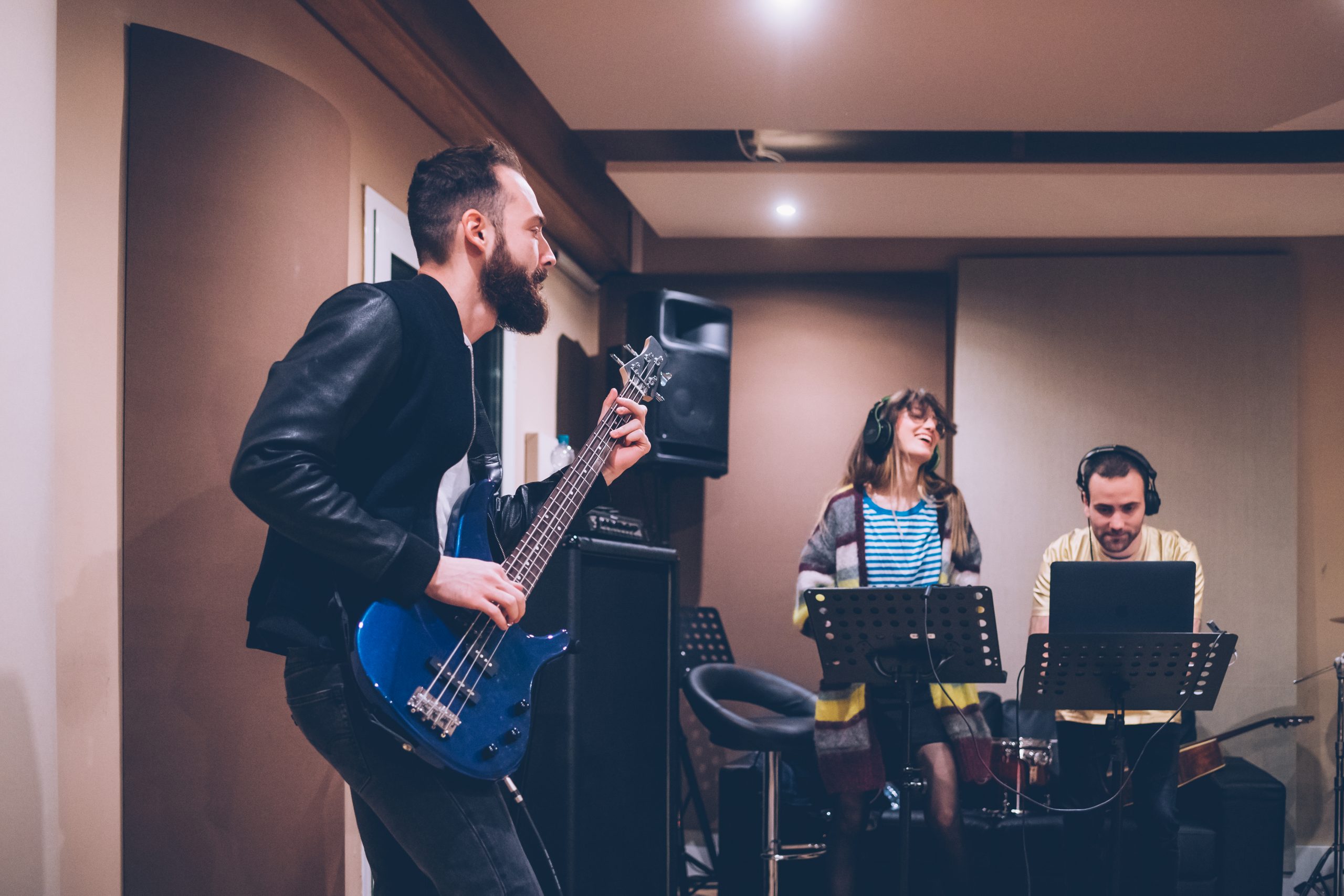 guy playing bass guitar in a studio